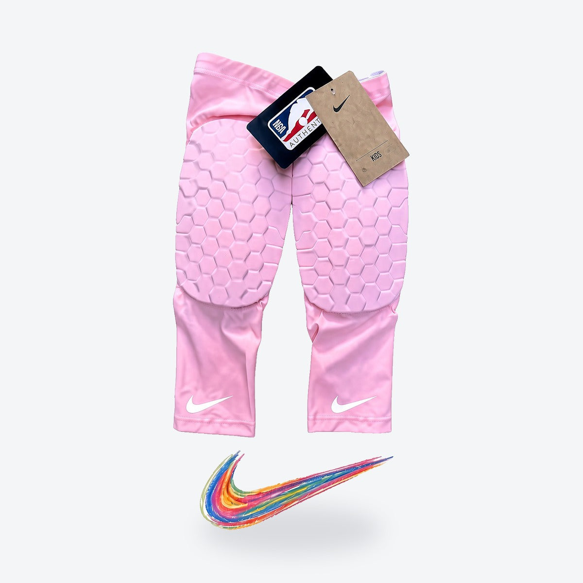 Rodilleras Nike Kid NBA – rosadas, par con su empaque